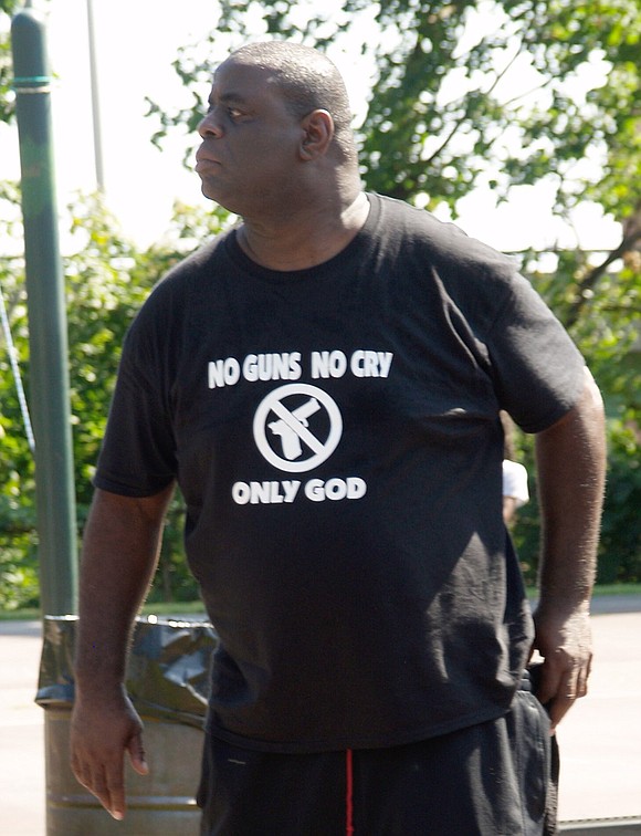 Wearing a shirt that reads “No guns, no cry, only God,” Lou Vincent, a Winston Salem, N.C. resident who spearheaded Unity Day almost 30 years ago with his brother Derek, stands on the basketball court.