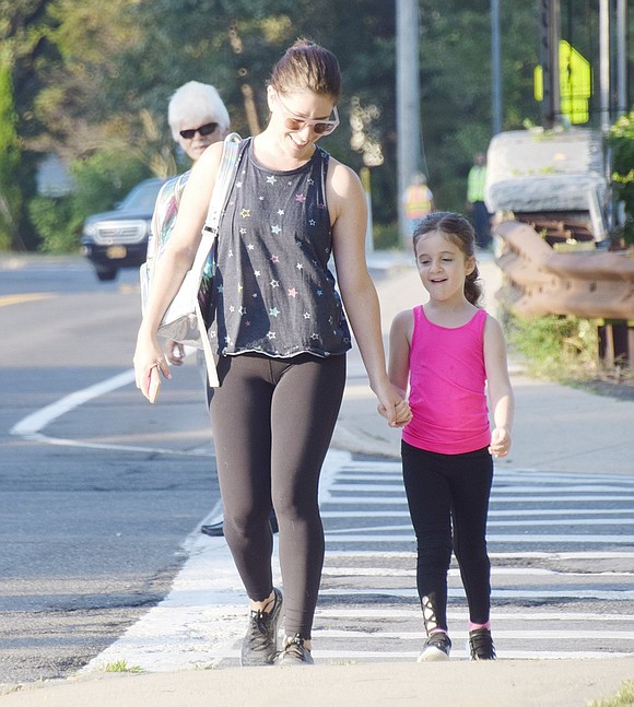 Old Orchard Road residents Sophie Schinfeld, a first-grader, and her mother Stacie are the first walkers to arrive at Bruno M. Ponterio Ridge Street School the morning of Wednesday, Oct. 2 for International Walk to School Day. Ridge Street was one of 4,474 schools that participated across the nation.