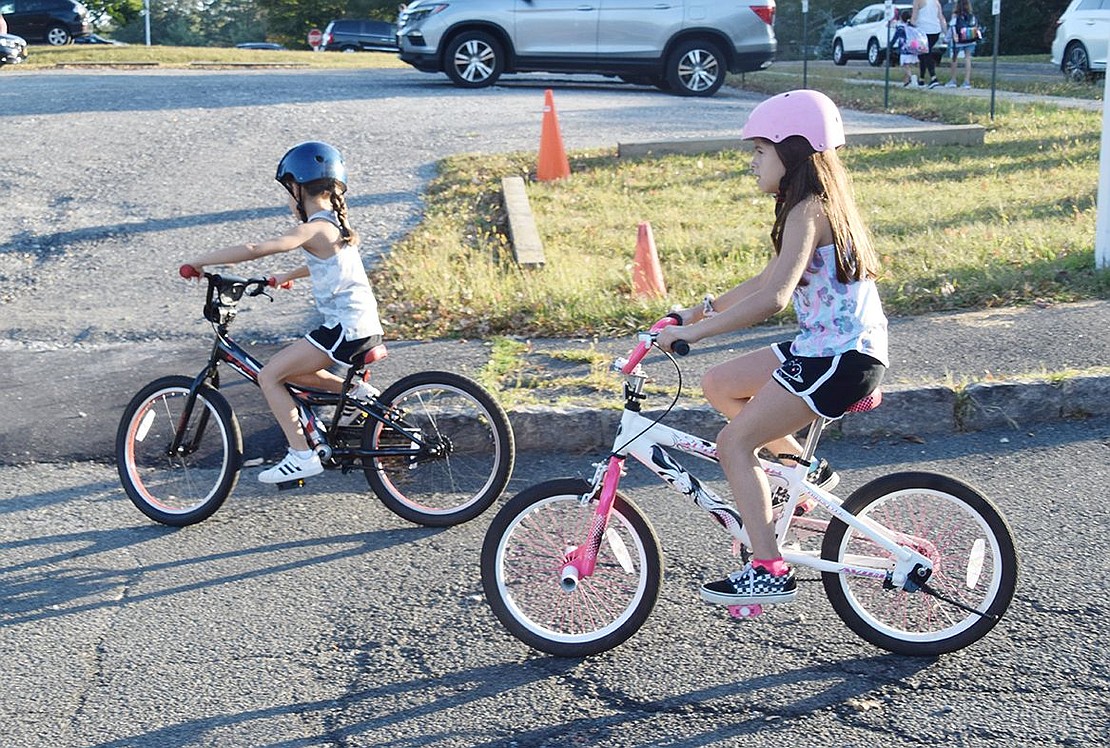 Third-grader Mia Zimmerman and fifth-grader Karly Vilato took International Walk to School Day to a whole new level by biking to Ridge Street School last Wednesday morning.