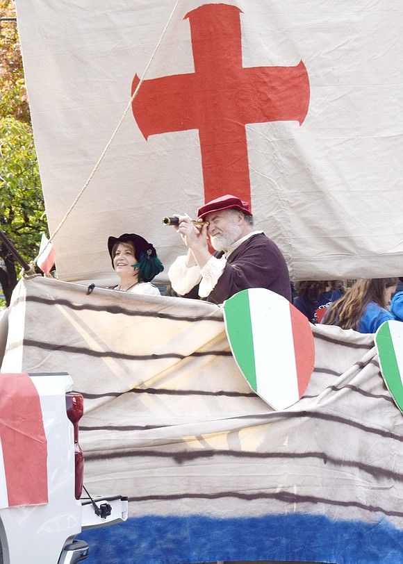 Christopher Columbus, played by Port Chester Italian Heritage Club member Stephen Tofano, sits on top of a parade float mimicking one of his iconic ships and looks out of his old-timey monocular.