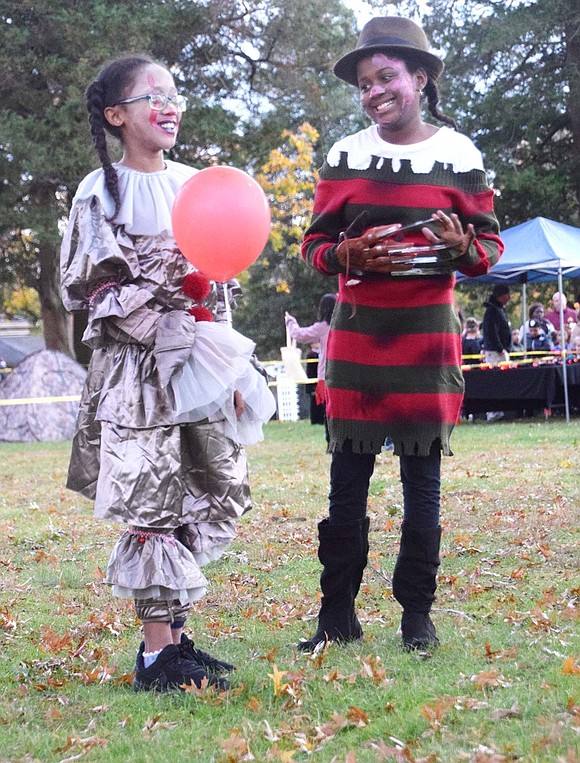 Ready to haunt some dreams and torment some children, the Adamson sisters went all out with their spooky costumes. John F. Kennedy School fifth-grader Faith holds the iconic red balloon as Pennywise while Port Chester Middle School seventh-grader Journey wears realistic Freddy Krueger razor gloves.