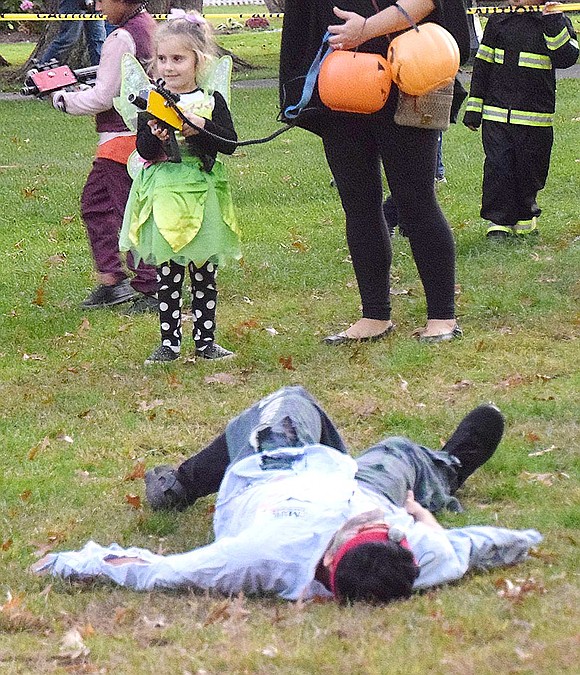 She may be sweet and sassy, but Tinkerbell, also known as Victoria Allmashy, can be dangerous if need be. The 4-year-old Mitchell Place resident proudly smirks after taking down a ghoul during zombie laser tag.