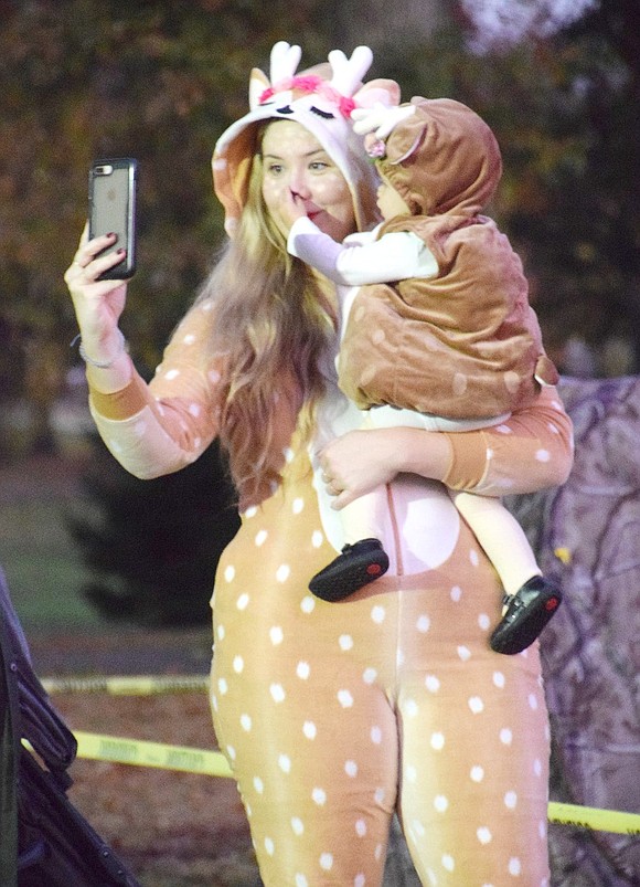 As Greenwich, Conn. resident Kate Sheil tries to take a mother-daughter selfie in her cute deer costume, her 1-year-old fawn Rylee Mae interferes by continuously bopping her nose.