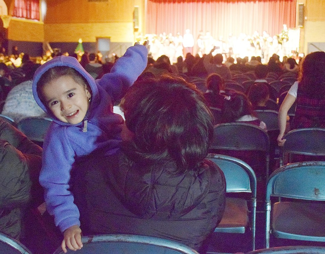 Very excited to be seeing a Christmas play, Madison Avenue 2-year-old Samara Gonzalez grins and points to the stage as the actors take their bows.