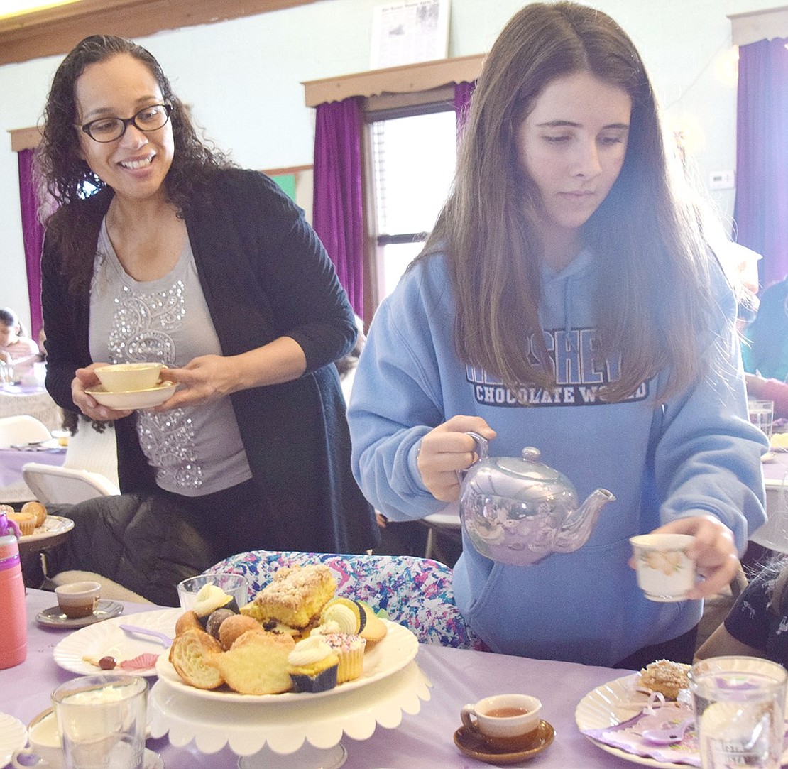 As one of the older Girl Scouts running the event, Port Chester Middle School seventh-grader Karah Provenzano is tasked with circling the room to refill pretty teacups as children munch on baked goods.