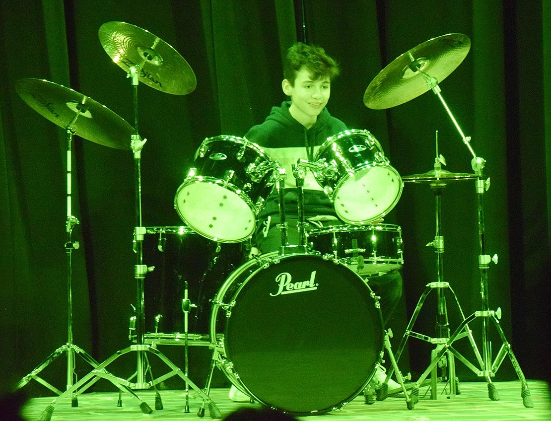 Eighth-grader Joseph Pistone is all smiles after he nails his drum solo. 