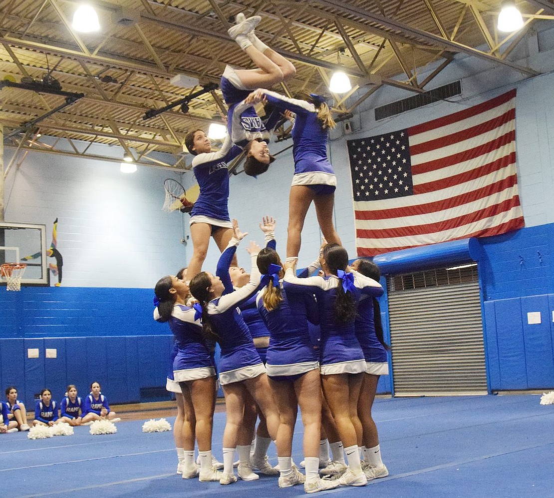 The junior varsity team show off their skills as ninth-grader Sophia Quartarolo gets spun in the middle of a pyramid.