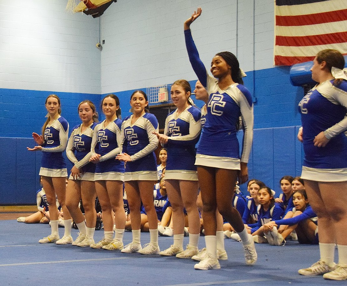 PCHS senior and varsity cheerleader Naomi Ash waves as she is recognized by her coaches and teammates.