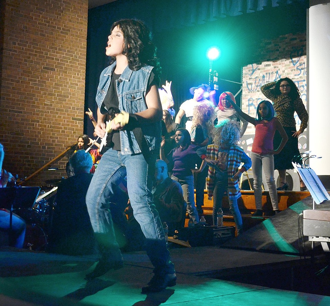 Bringing Twisted Sister’s intense words to the stage, Drew Boley (played by Gage Saresky) sings “I Wanna Rock” during a rehearsal for the Port Chester Middle School Drama Club’s upcoming production of “Rock of Ages.” The show will perform on Thursday, Feb. 6, at 4 p.m. and Friday and Saturday, Feb. 7-8, at 7 p.m. Tickets are $10 for adults, $8 for students and seniors, $15 for premium seats and can be purchased before the show at showtix4u.com/event-details/36007.