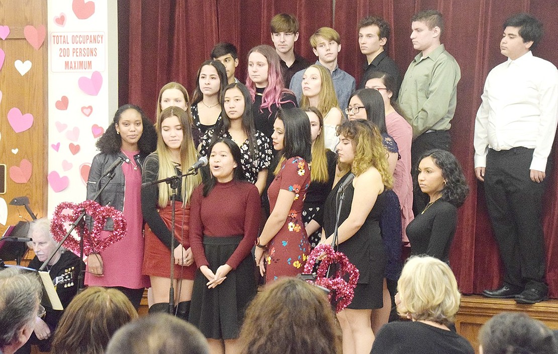 The entire Port Chester High School Select Choir kicks off the annual Valentine’s Day Cabaret on Tuesday, Feb. 11, with a group rendition of “True Love” featuring soloist senior Lindsey Co in the middle.