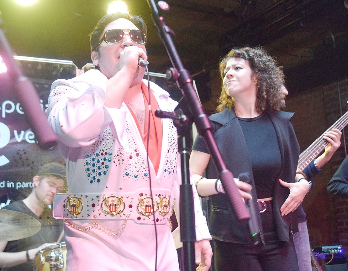 Disguised as rock and roll legend Elvis Presley, 29-year-old co-founder of the Especially Everyone Ensemble Nicholas Carriero sings the classic song “Burning Love.”