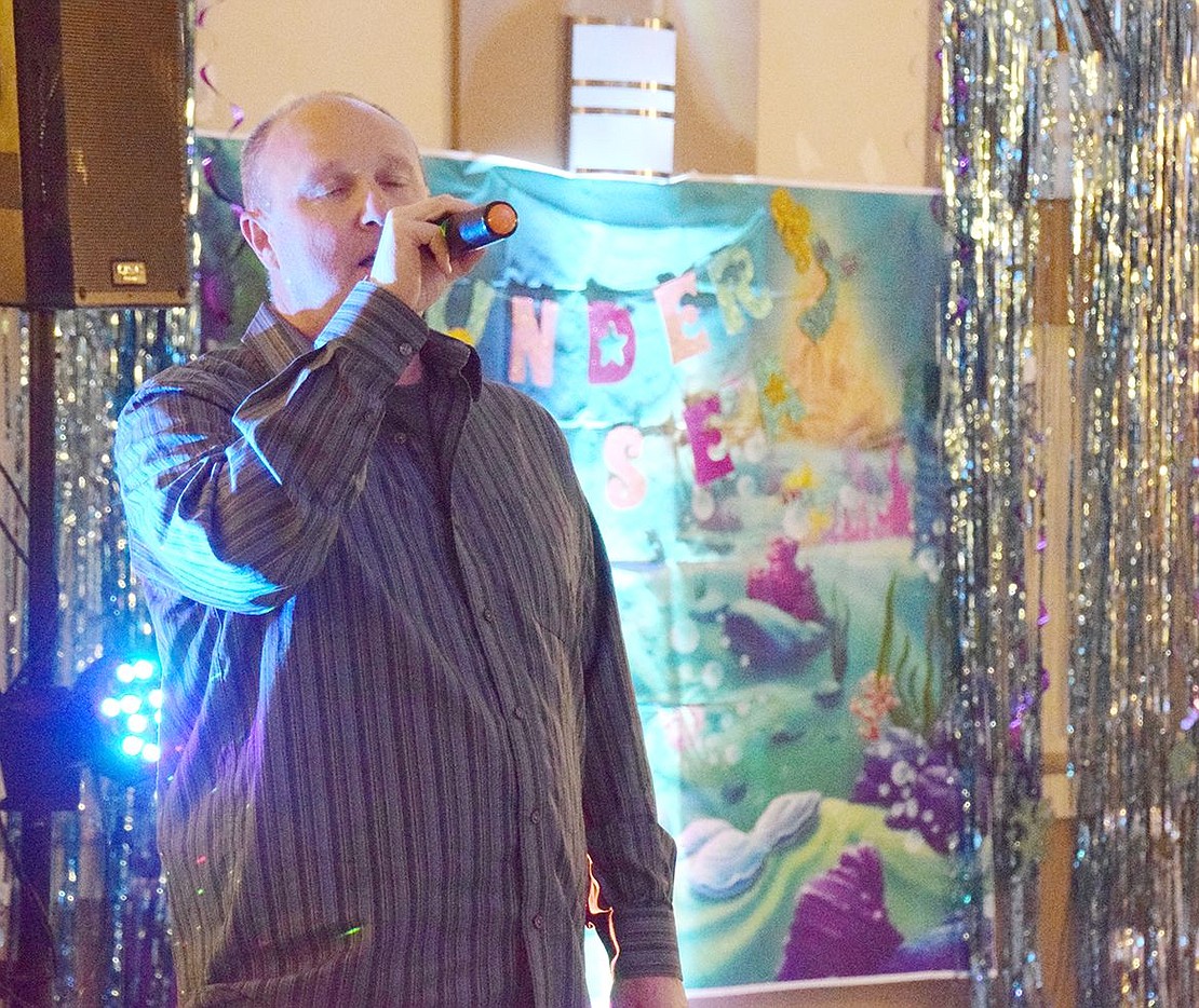 After the DJ urges more adult participation from the crowd, Port Chester resident Peter Pascale stands in front of festive under the sea decorations to sing “What You Won’t Do for Love” by Bobby Caldwell with soul.