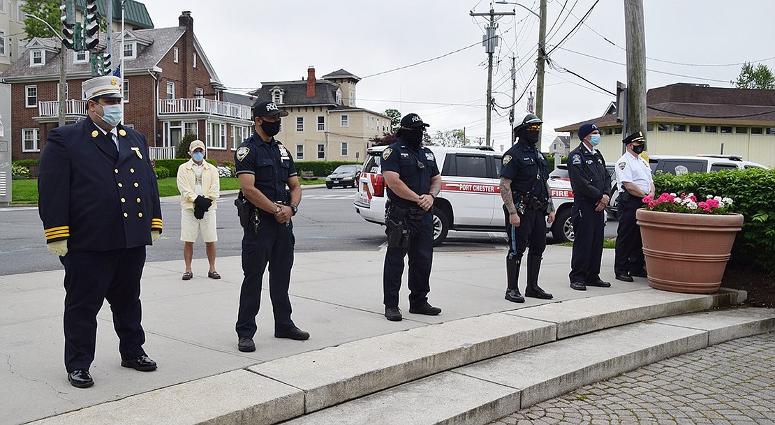 First responders stand at the edge of the park during the ceremony. Along with service members who gave their lives, first responders and healthcare workers on the front lines battling COVID-19 were recognized. 