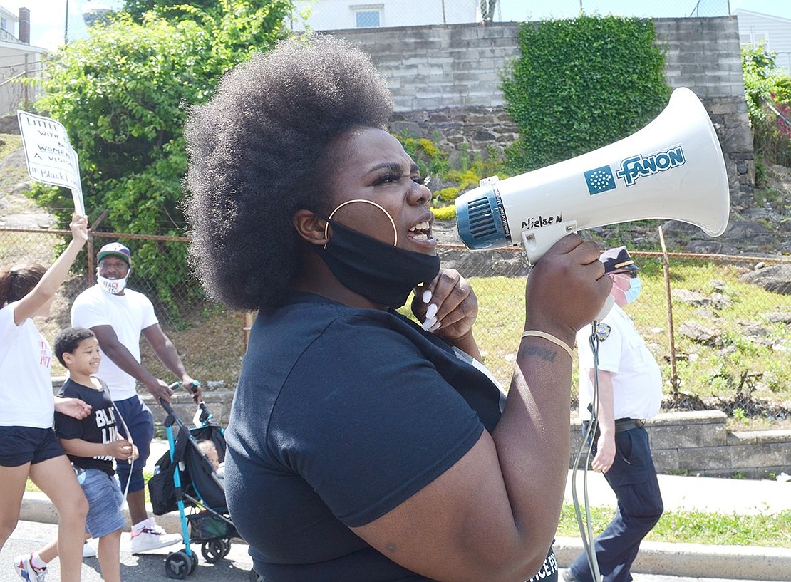 Protest organizer Whitney Black chants “Black lives matter!” as she leads a group of 2,000 marchers down Ryan Avenue.