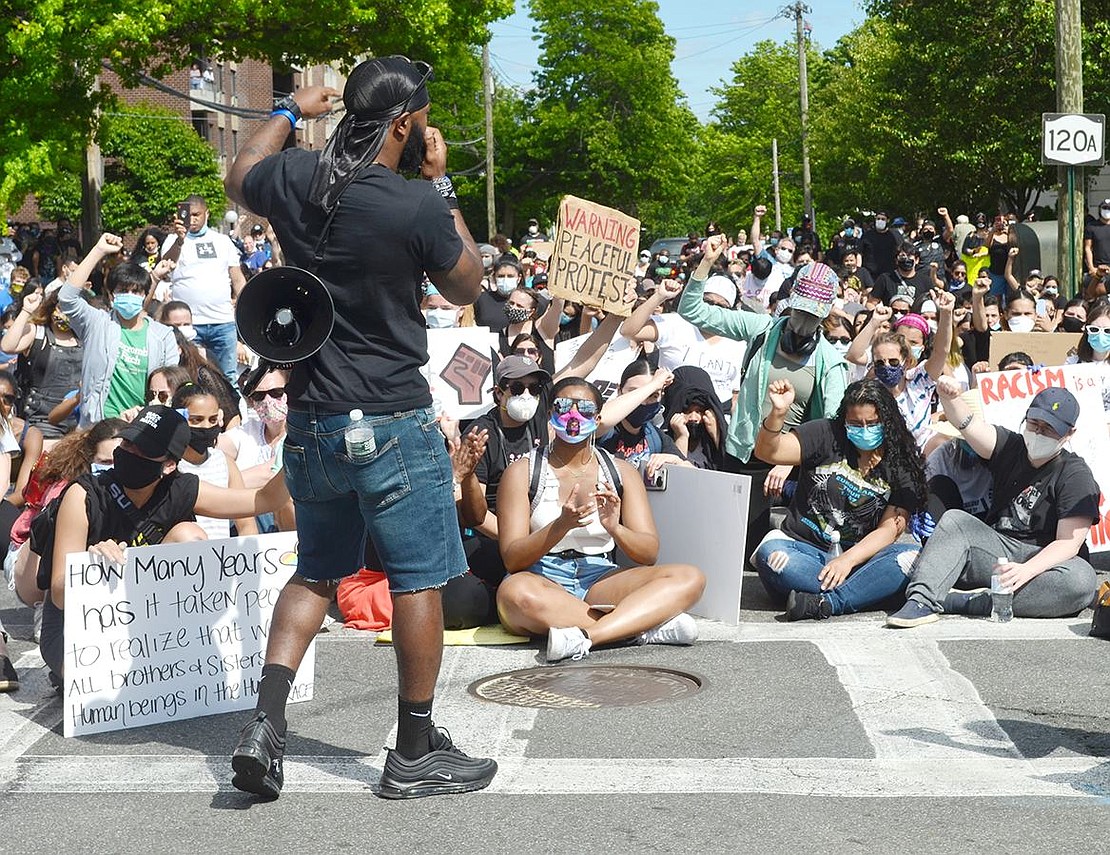 Matt Moody, one of the protest’s organizers, spreads a message of unity throughout the crowd.