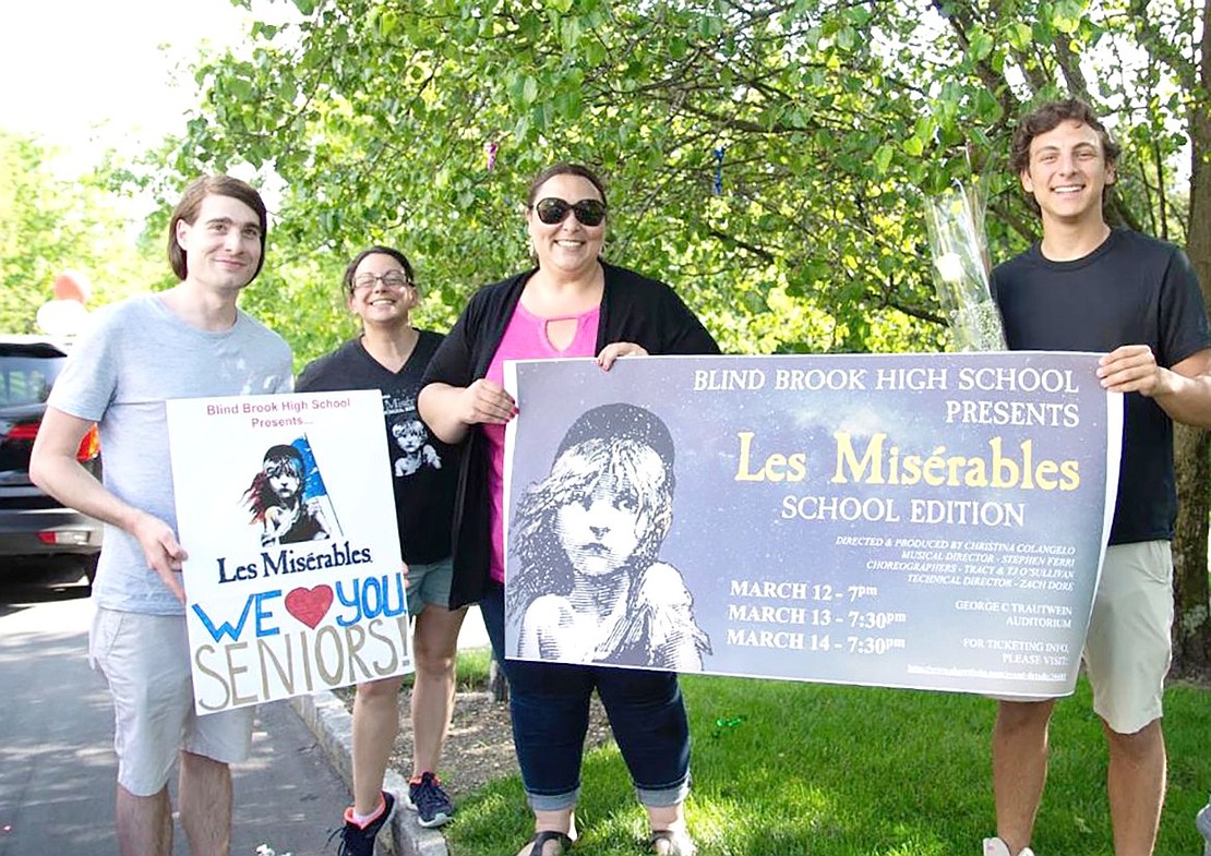 Senior Adam Marek (right), who was cast as Jean Valjean, poses with the production’s director, Christina Colangelo, choreographer Tracy O’Sullivan and musical director Stephen Ferri.