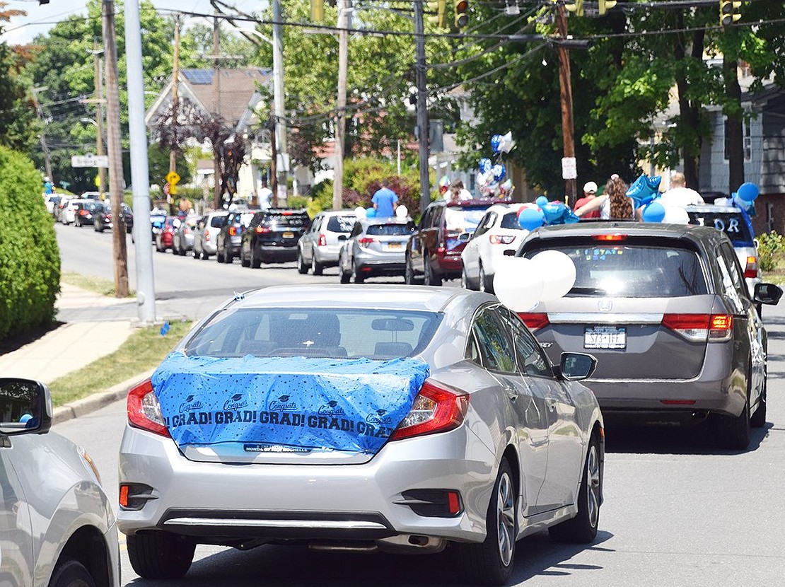 Over 100 decorated cars filled with Port Chester High School graduating seniors drive down North Regent Street.