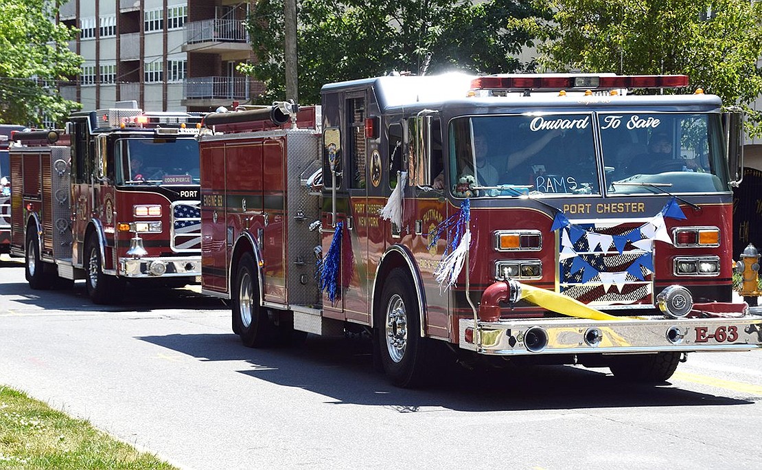 Port Chester firefighters decorated the engines to show support for the Rams as they lead the procession down Westchester Avenue.