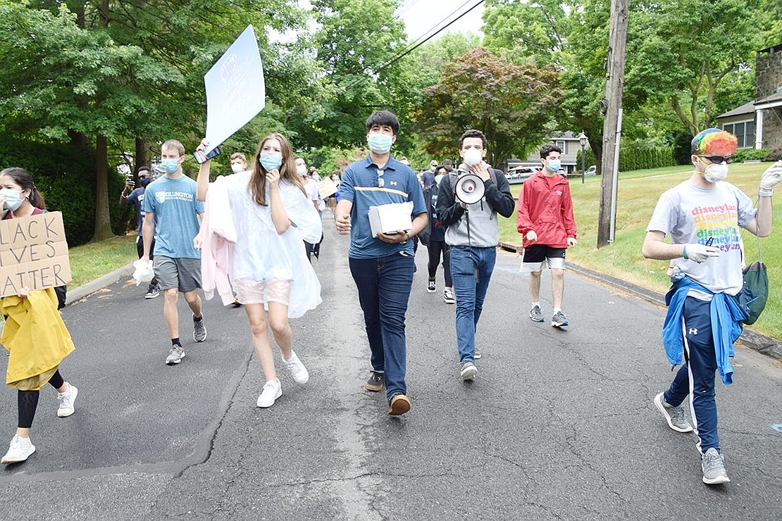 Blind Brook High School rising junior and protest organizer Raghav Joshi leads the march down Old Orchard Road.