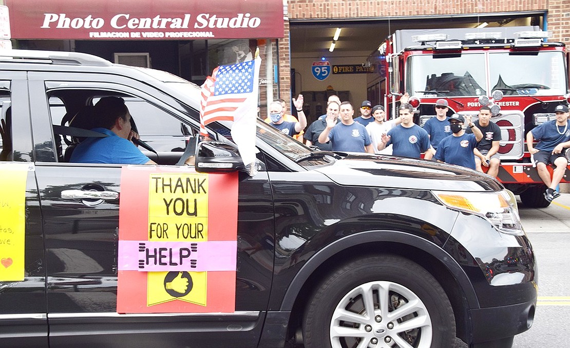 Port Chester Trustee Alex Payan leads the car parade down Westchester Avenue as motorists recognize the Port Chester Fire Department. The caravan of cars drove throughout the Village of Port Chester on Saturday, June 27, to celebrate the frontline workers of the COVID-19 pandemic.