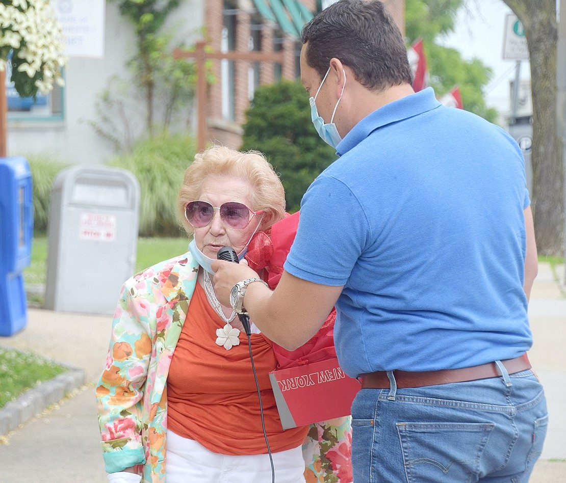 At the end of the parade, Westchester Avenue resident Elda Navarro, who came up with the idea to form the caravan, highlights the hard work of the Port Chester Police Department. 
