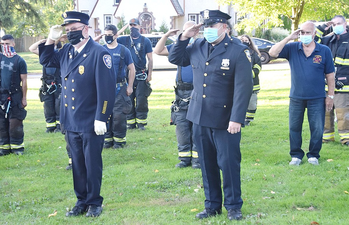 Port Chester first responders salute during the ceremony to remember the lives lost in the Sept. 11 terrorist attacks 19 years ago.