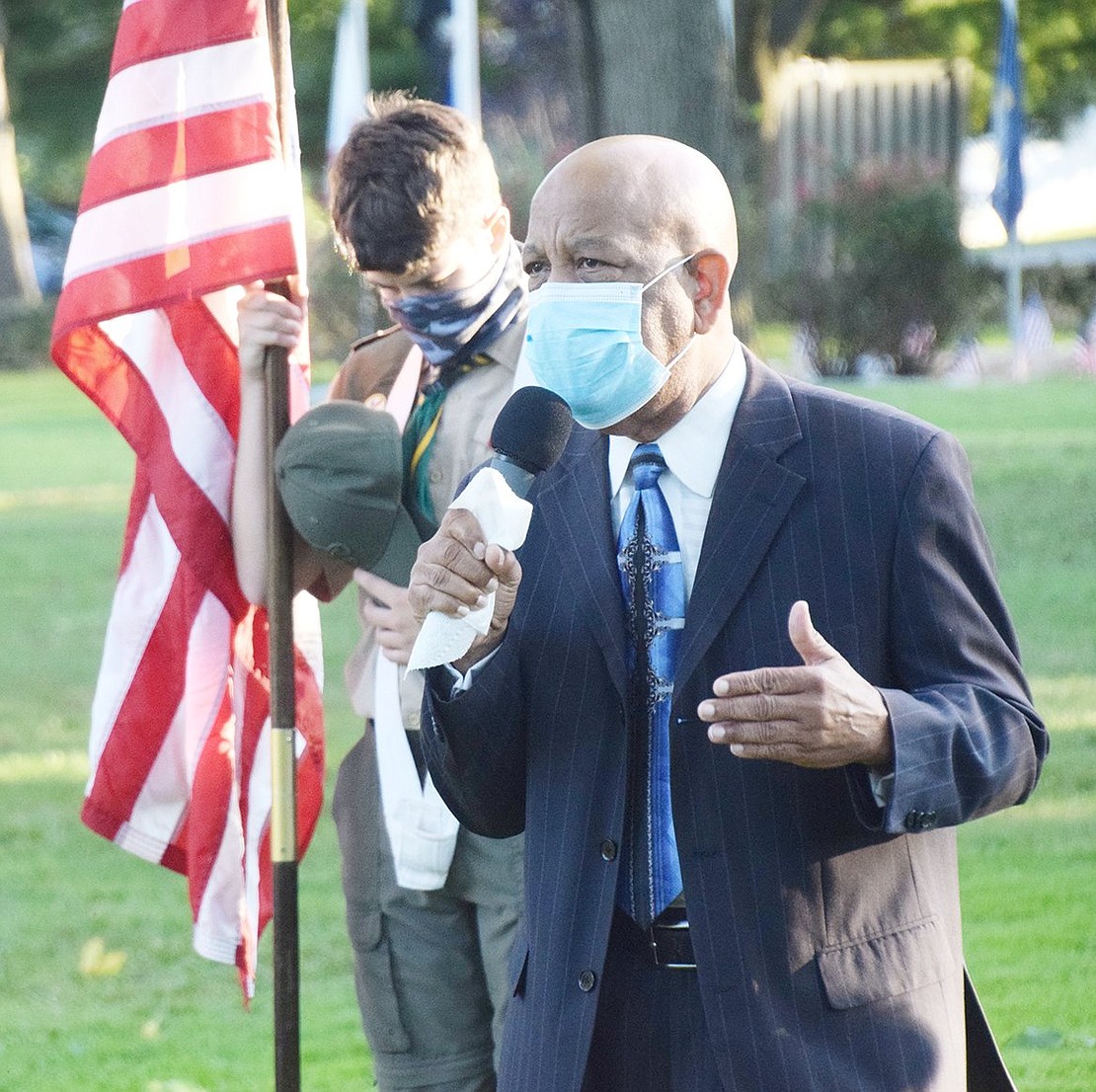 Girtman Memorial Church of the Living God pastor Bishop Robert Girtman provides a spiritual message to the small crowd that gathered in Lyon Park on Friday, Sept. 11.