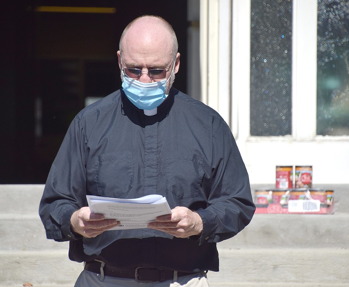 St. Paul’s Pastor Jim O’Hanlon begins the Blessing of the Animals in observance of the feast of St. Francis of Assisi. The church also collected pet food for the Humane Society of Westchester and monetary donations for FURRR 911.