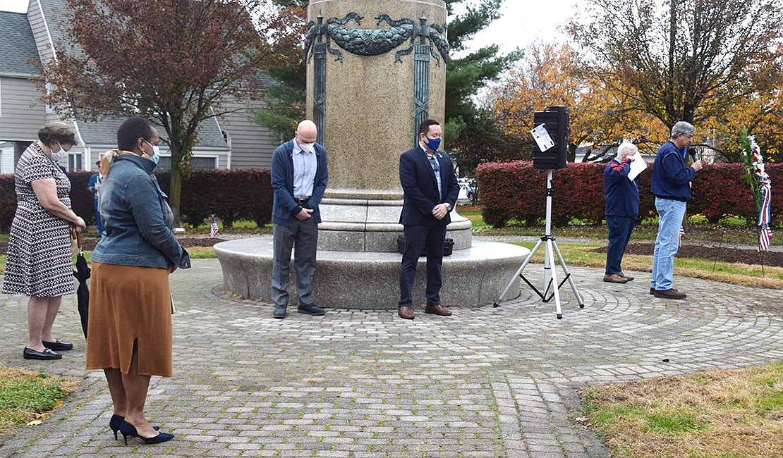 Former Port Chester Trustee Dan Colangelo gives the invocation at the ceremony honoring all veterans for their service. It was attended by Port Chester Mayor Richard “Fritz” Falanka, Village Trustees Alex Payan, Frank Ferrara and Joan Grangenois-Thomas and County Legislator Nancy Barr, who gather around the central monument in the park.