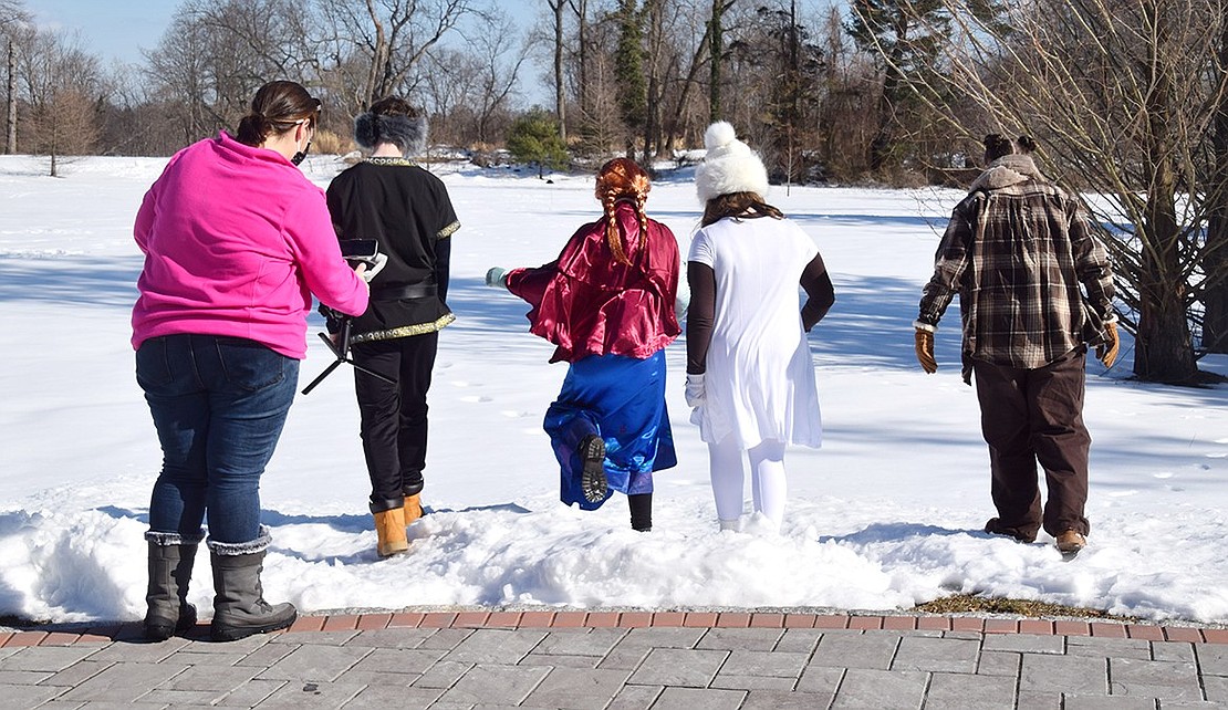 Blind Brook Middle School Musical Program Director Julie Colangelo-Doré records with her cellphone on a tripod as Kristoff, Anna, Olaf the snowman and Sven the reindeer (played by Sean Spohrer, Grace Brunetti, Madilyn Klein and Aviella Kibel) head off for an adventure during a “Frozen, Jr.” rehearsal on Feb. 6. Instead of a traditional Spring play, students produced a film using Crawford Park and Mansion as their set.