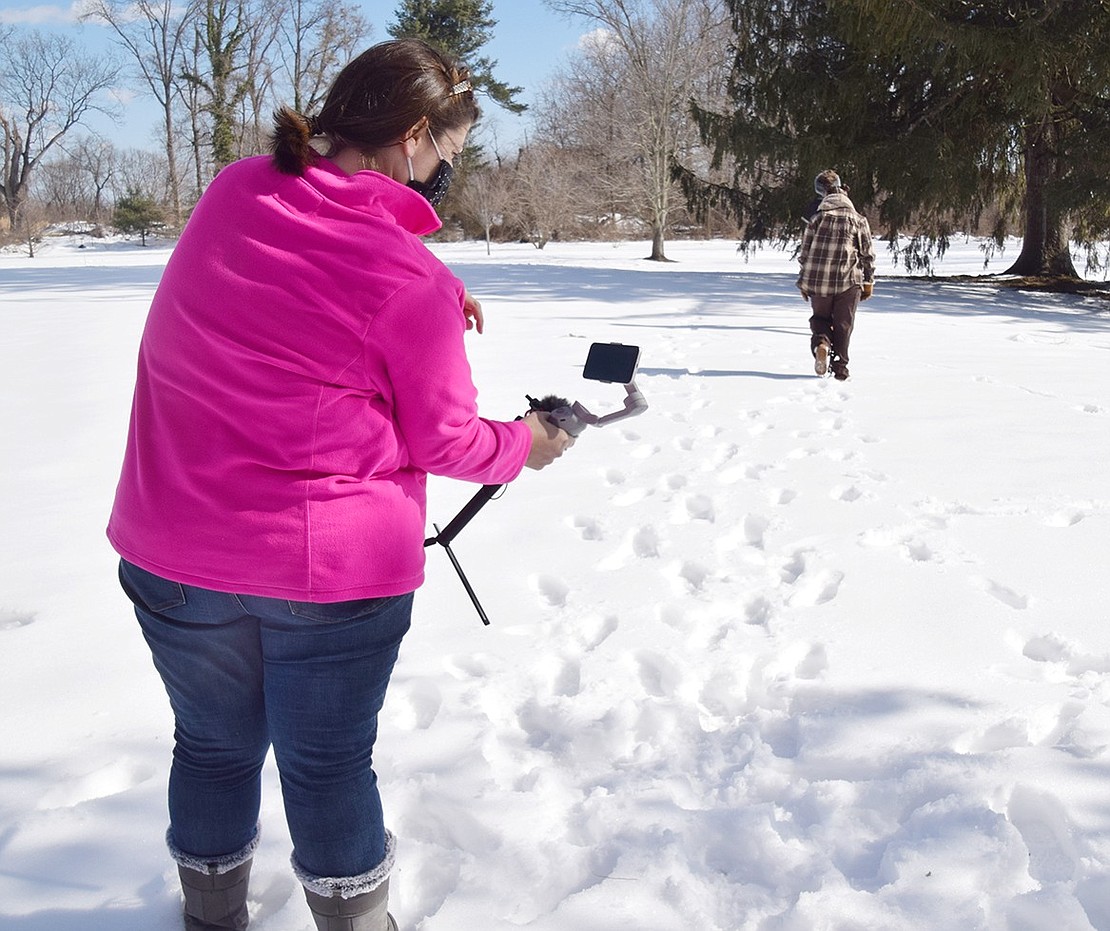 As Sven the reindeer (played by Aviella Kibel) walks into the snowy distance, Director Julie Colangelo-Doré moves the camera down and angles it upward to capture a dramatic shot.