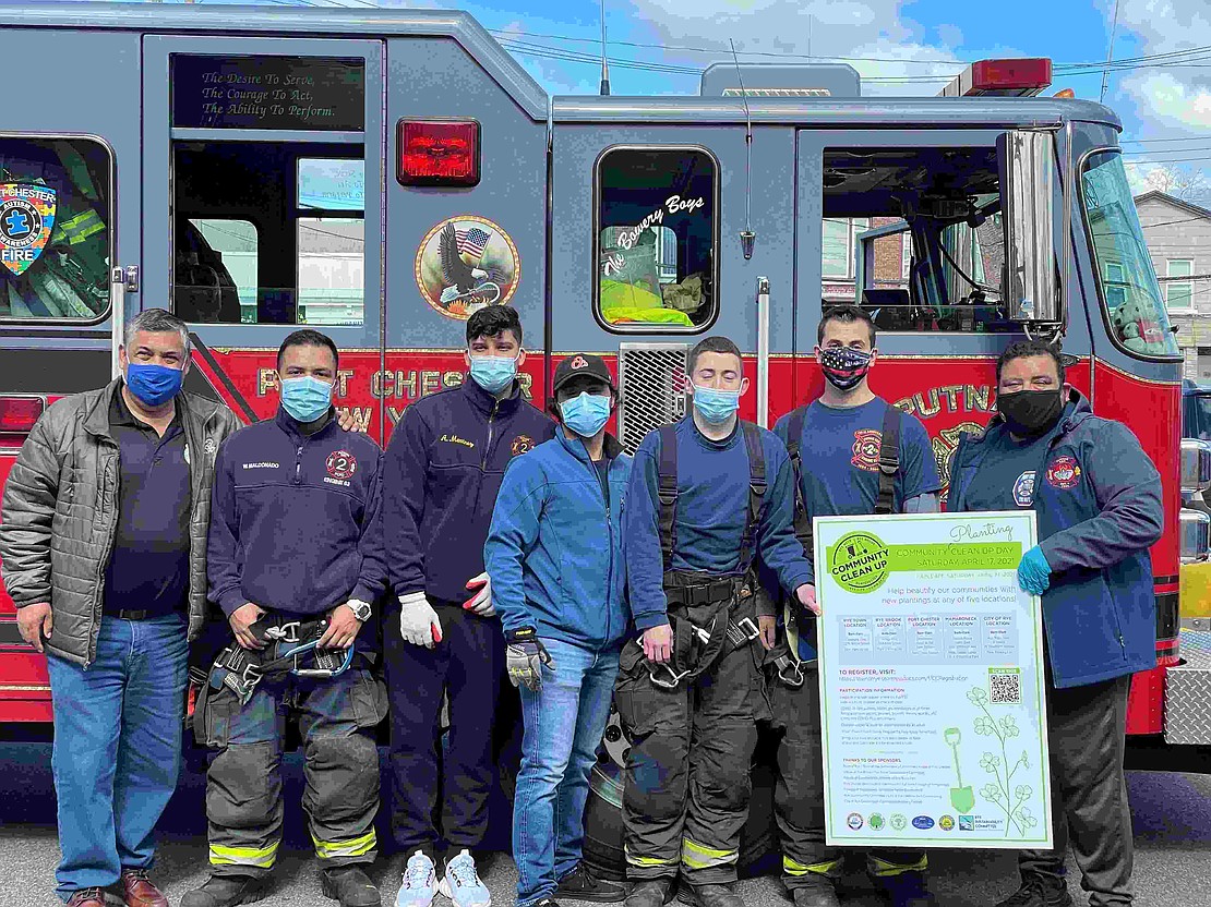 Port Chester Fire Department crews assisted in the clean up on Saturday, mounting trash bags on the front of Engine 63 and trucking them off to the DPW site. Firefighters pose for a photo with Port Chester Mayor Luis Marino during the project. Courtesy of Melissa Grieco 