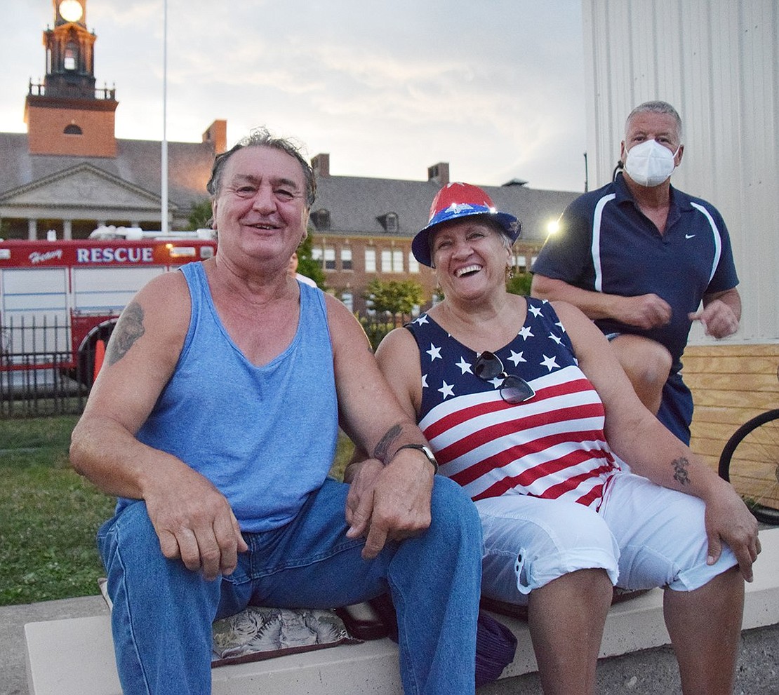 Waiting in the stands at John Ryan Stadium for the fireworks, Mitch Kruczkiewicz, a Port Chester native, and Sarah Duplessis of New Milford, Conn. are all decked out for the Fourth of July. Joining them at right is Chris Santora Stewart, a lifelong Port Chester resident and 1976 Port Chester High School graduate.