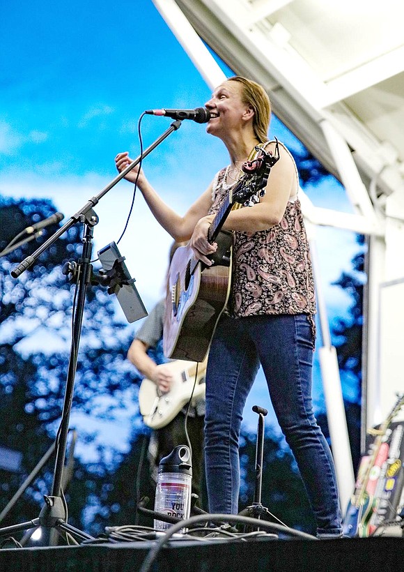 Port Chester resident Julie Corbalis takes a high note on one of the band’s final covers, Ben King’s “Stand By Me.” The show began at 7:30, though it was nearly rained out. Corbalis and her bandmates, known as The Julie Corbalis Band, immediately began playing once they were given the green light.