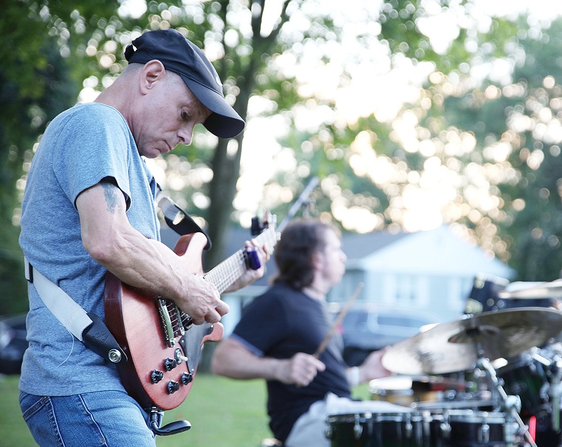 Andrea and the Armenian Rug Riders lead guitarist John Scavelli and drummer Brett Roberts stay in sync as they play Stealers Wheel’s classic “Stuck in the Middle with You.”  