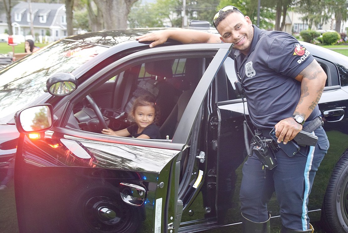 Move over, Officer David Arroyo! There’s a new cop in town. Alondra Ojeda, a soon-to-be kindergartener at King Street School, naturally takes the wheel while sitting in a police vehicle during a demonstration.