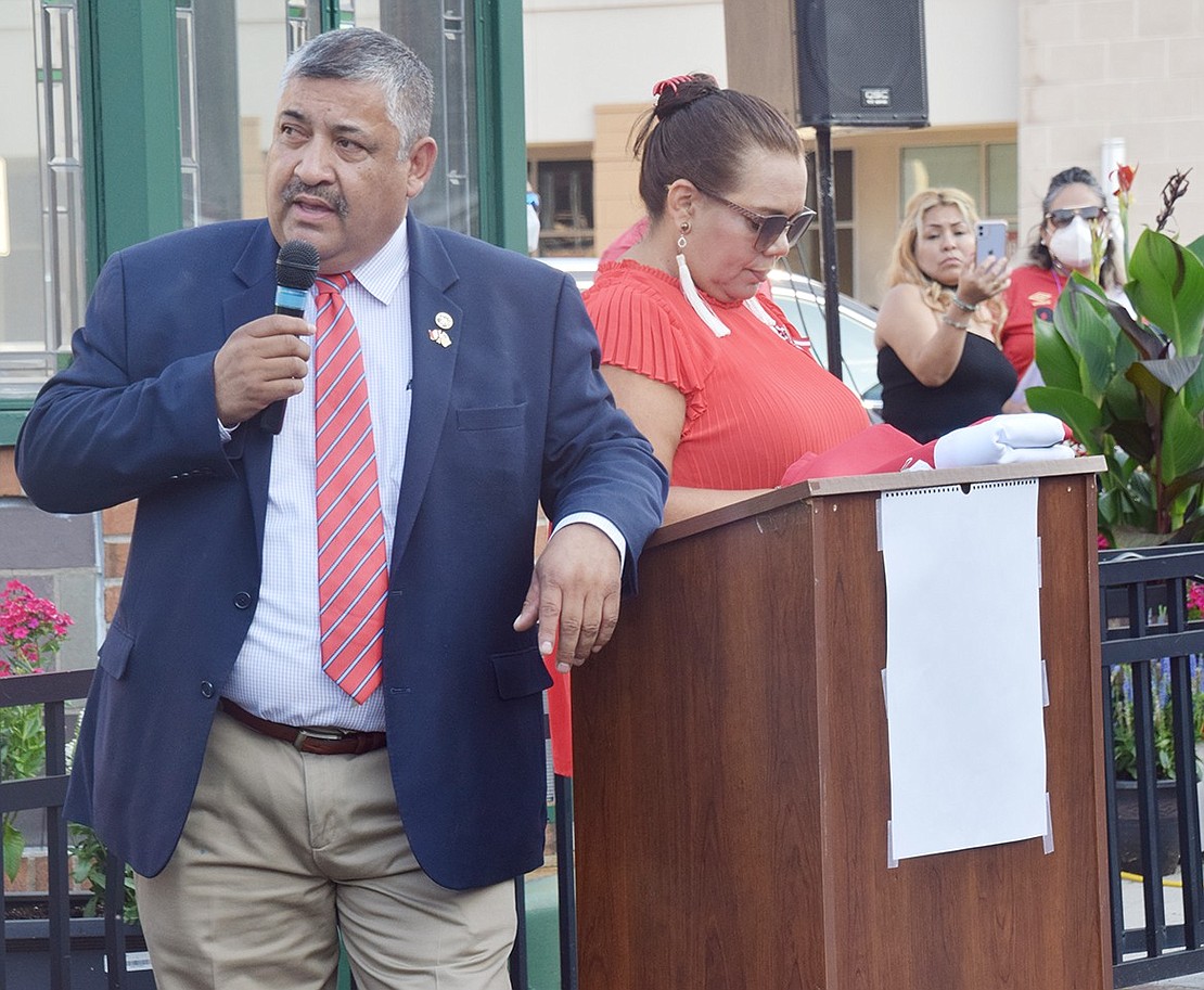 Mayor Luis Marino, standing next to MC Carmen Guevara of Elmsford, welcomes the crowd assembled in Liberty Square to celebrate the 200th anniversary of Peru’s independence.
