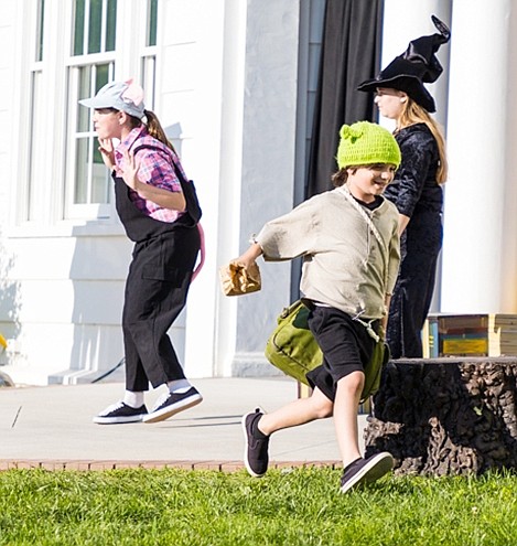 Wicked Witch Katherine Callaway of Port Chester and one of the Three Little Pigs, Kendyl Inesta of Greenwich, send Little Ogre MJ O’Neill of Rye Brook out into the world. 