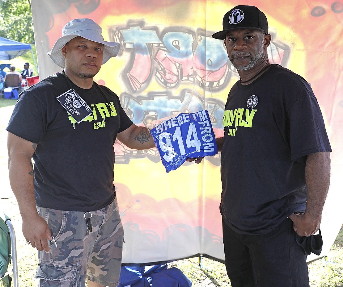 Representing their 914 pride, Palace Place resident Sean Welch and King Street resident Ree Welch hold up their customized apparel at the event. 
