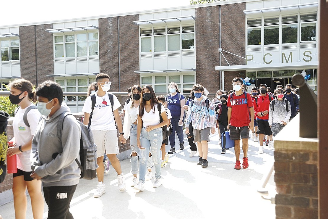 Port Chester Middle School students pour out of the building after school on Monday, Sept. 13, their first Monday of the school year.