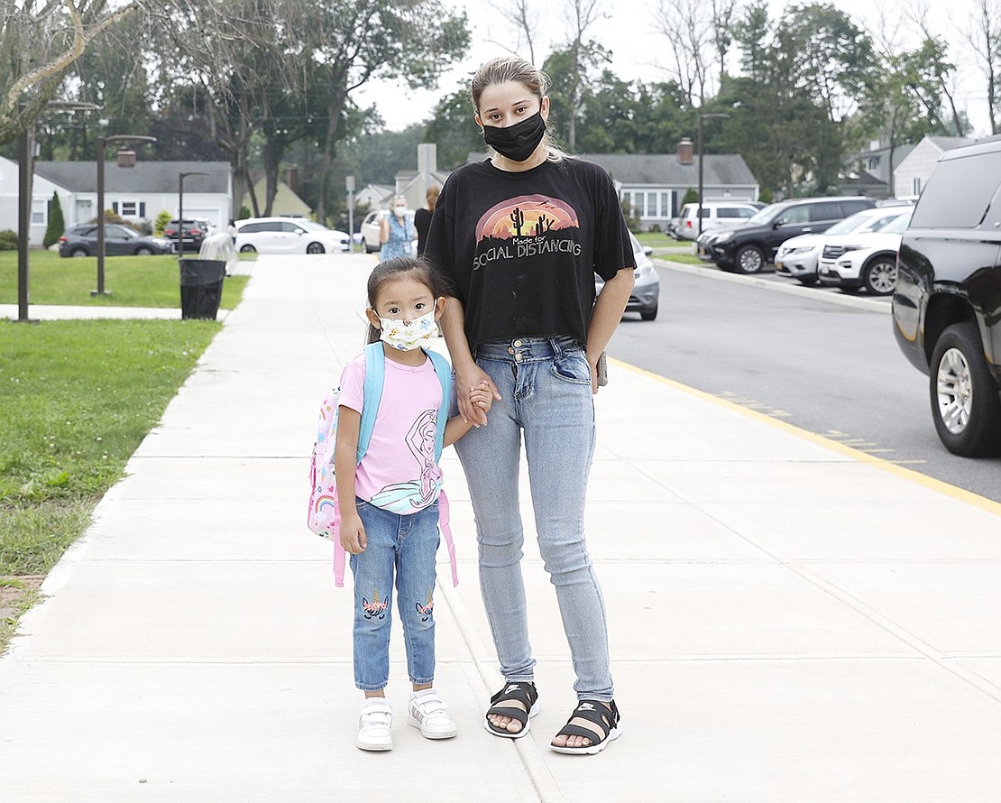 Silvia Monroy walks kindergartener Ana Monroy to King Street School on Wednesday, Sept. 15.