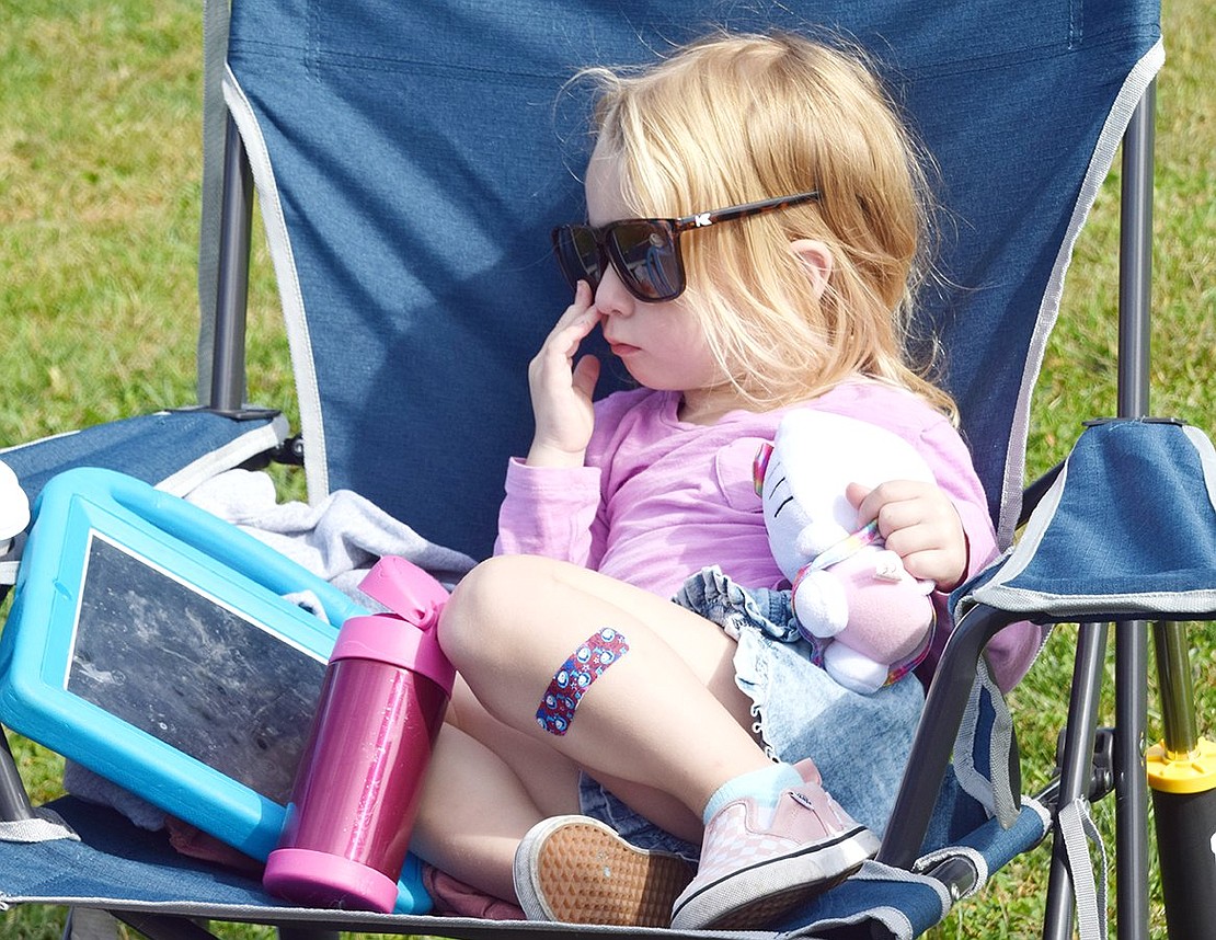 Exhausted after a long day of manning the PTA booth with her mother, Blind Brook Student Assistance Counselor Monique Tricarico, Taylor, a 2-year-old Elmsford resident, finds a comfy spot to take a much-needed break.