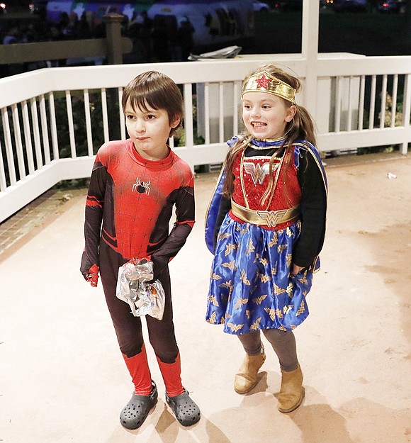 Port Chester 4-year-olds Alexander Valad (left) and Charlie Conetta embrace their inner superheroes while dancing side by side in the gazebo.