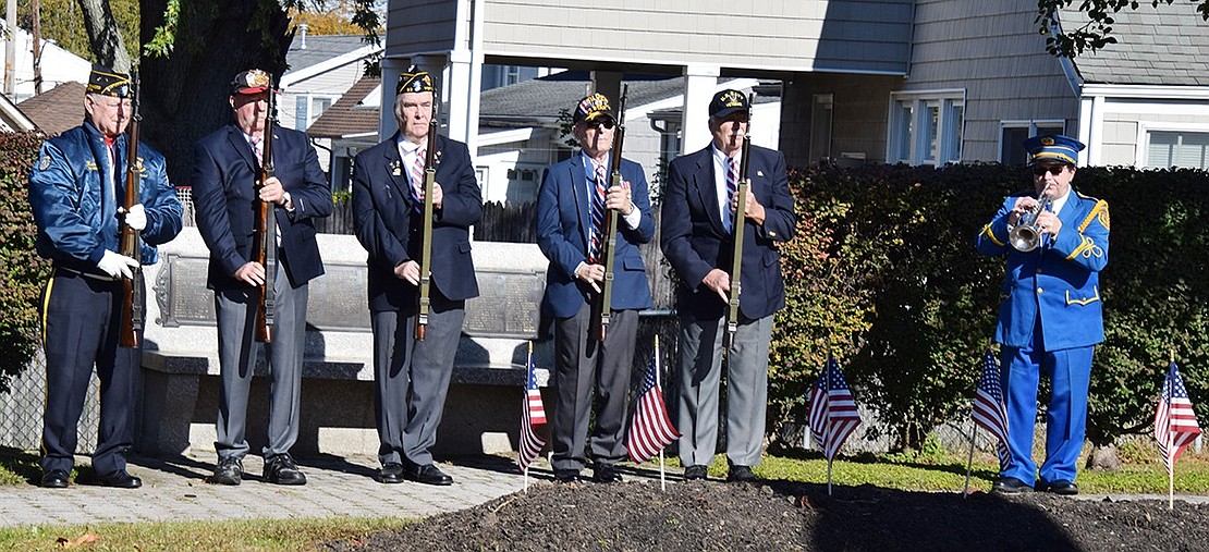 Bugler Anthony Bubbico, Jr. of the Port Chester American Legion Band plays Taps in memory of those veterans who have died after American Legion Firing Squad members Kenny Neilson, William Sullivan, Jr., Bill Chiappetta, Tommy Giorgi and Vinny Lyons fired shots to honor all veterans.