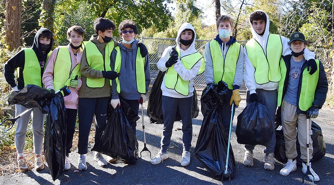 From left, Rye Brook freshmen Cooper Schloss (Blind Brook High School), Dylan McRedmond (BBHS), Luka Cuk (BBHS), Antonio Gerardi (Iona Prep), Cameron Scott (BBHS), Kieran Degen (Iona Prep), Danny Wilk (BBHS) and Daniel Keilman (BBHS) call it a day after spending the morning of Nov. 6 picking up trash on Bowman Avenue.