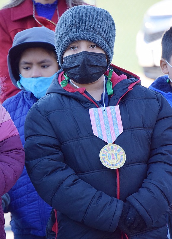 Park Avenue School fifth-grader Carlos Hernandez proudly displays his Veterans Day medal.
