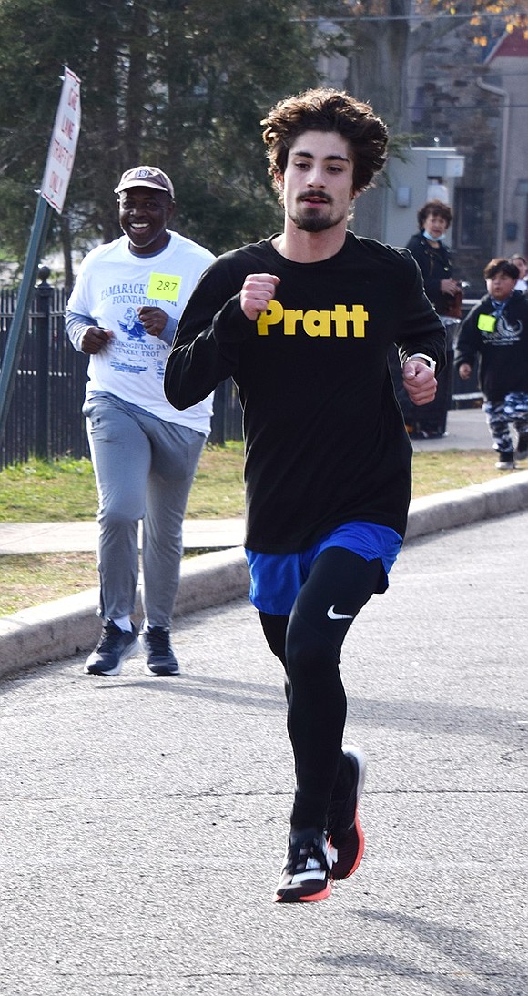 2021 Port Chester High School graduate and long-distance runner Tommy Perrone crosses the finish line first.