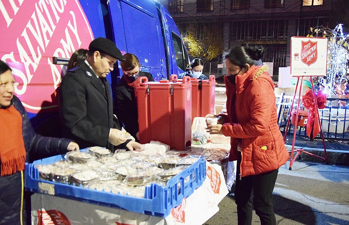 Although it was a warm night, the Port Chester Salvation Army was prepared for a colder one, handing out hot chocolate and coffee cake to willing takers.