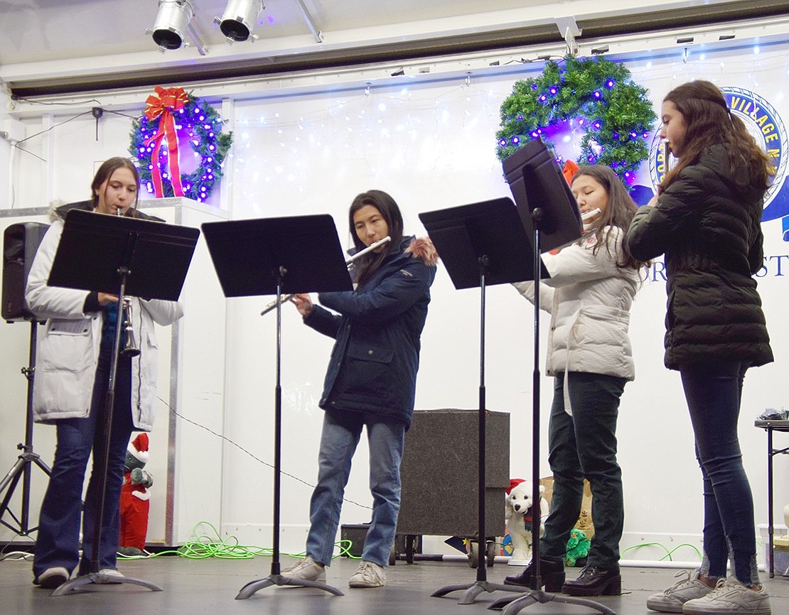 Is Old Saint Nick visiting Rye Brook soon? He must be, because a Blind Brook High School freshman wind quartet is lighting up the stage with “Santa Claus is Coming to Town.” From the left: Madeline Hirsh, Emily Tian, Charlotte Zelin and Rachel Horn.