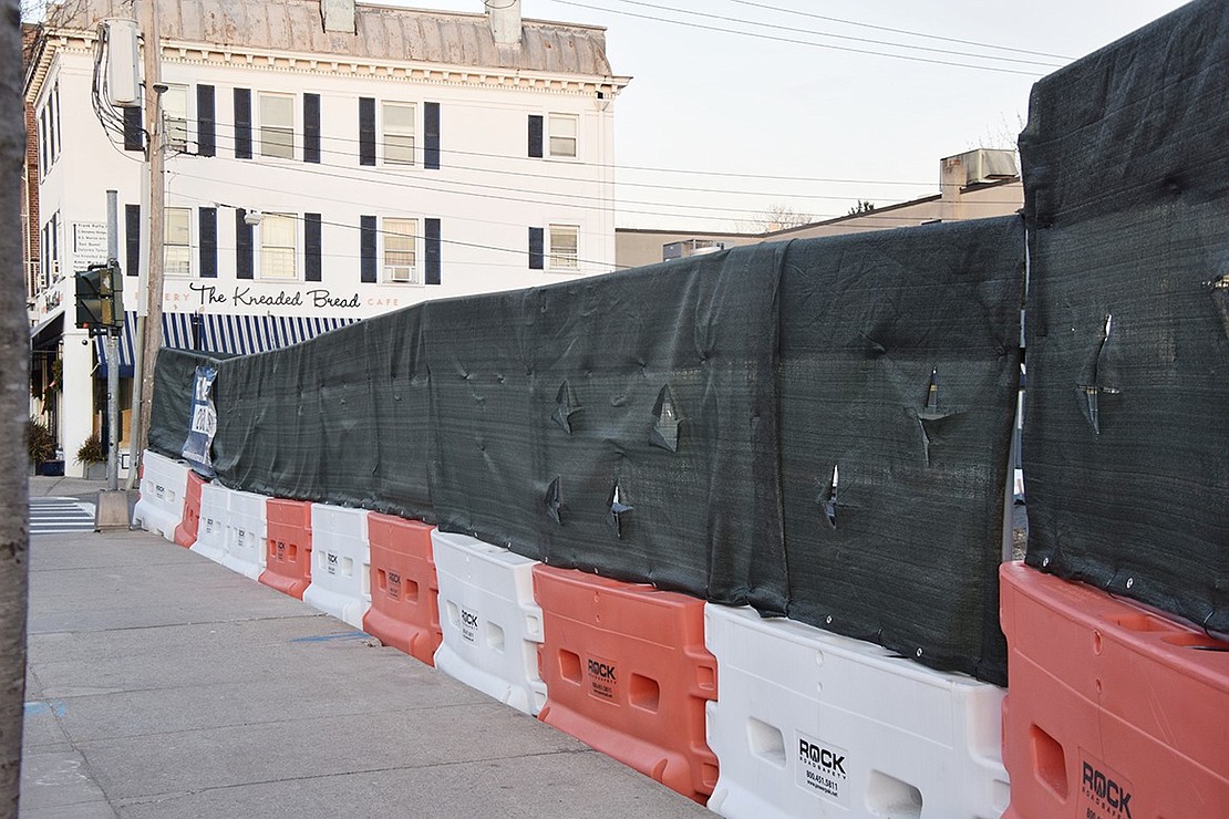 Barriers block off the buildings that were knocked down in short order at the corner of North Main and Mill streets. The 6-story Tarry Lighthouse mixed-use project will eventually rise at that spot with 209 residential units, 28,000 square feet of street level shops, 271 parking spaces and various amenities. However, a deal has not been reached with X-S Hair which is still open in the adjacent building which all other tenants have vacated, putting a cog in the wheel.